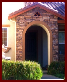 Ledgestone masonry veneer on exterior house entry